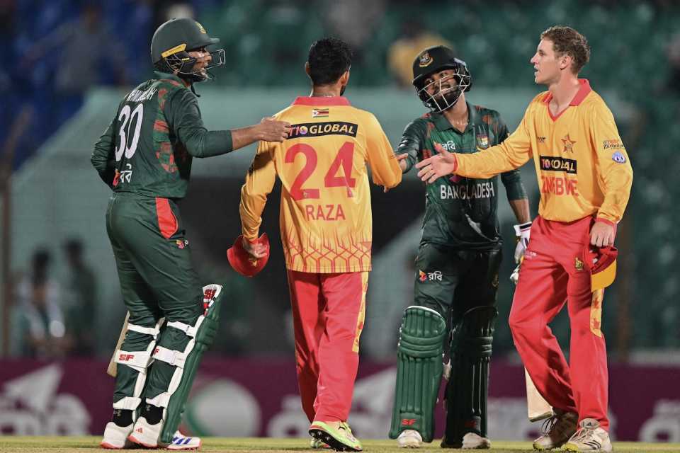 The Bangladesh and Zimbabwe players shake hands after the game