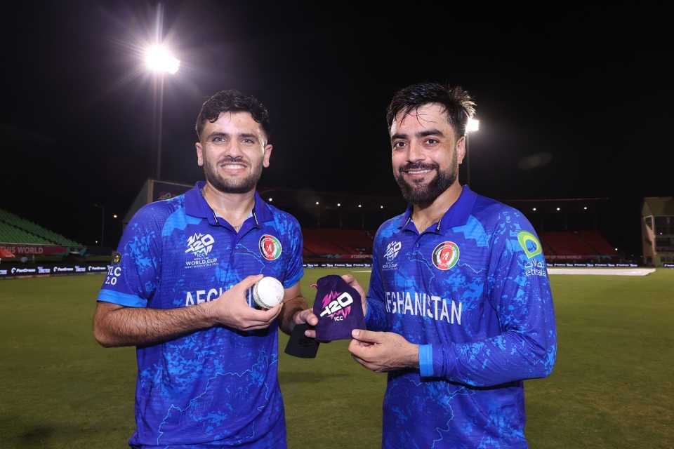 Player-of-the-Match Fazalhaq Farooqi strikes a pose with his captain Rashid Khan, Afghanistan vs Uganda, T20 World Cup 2024, Providence, June 3, 2024