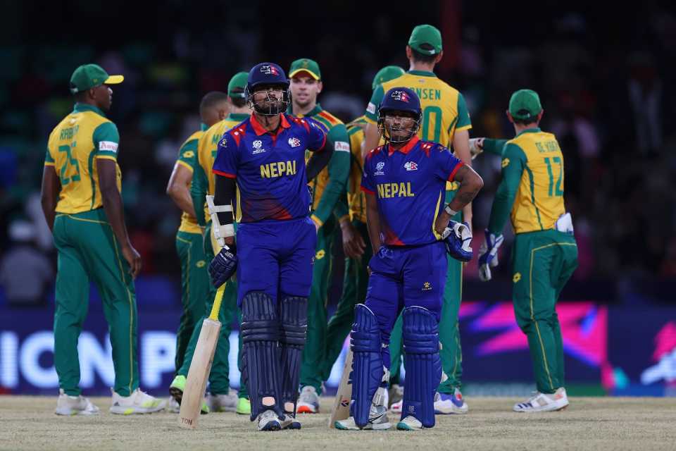 Gulsan Jha and Sompal Kami wait for the the third umpire's run out call on the last ball, Nepal vs South Africa, Men's T20 World Cup, Kingstown, June 14, 2024