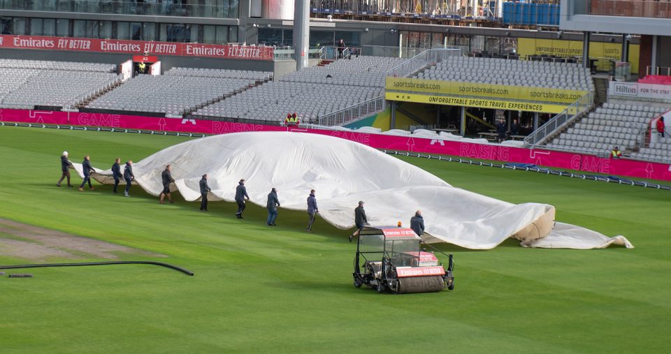 The Old Trafford groundstaff tackle the covers after Storm Lilian, England vs Sri Lanka, 1st Test, Emirates Old Trafford, 3rd day, August 23, 2024