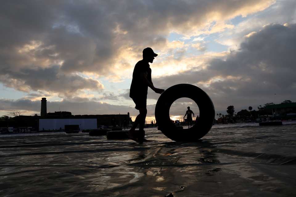 Groundstaff get tires on the ground to hold down the covers, Sri Lanka vs Australia, 1st Test, Galle, 2nd day, January 30, 2025