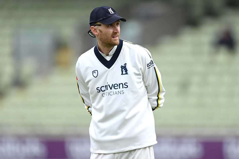 Olly Hannon-Dalby tries to stay warm in the field, Warwickshire vs Durham, County Championship, Division One, Edgbaston, April 14, 2024