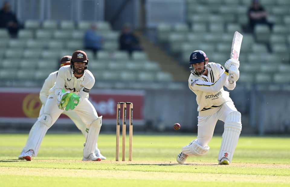 Ed Barnard drives as Ben Foakes looks on, Warwickshire vs Surrey, County Championship, Edgbaston, May 9, 2025