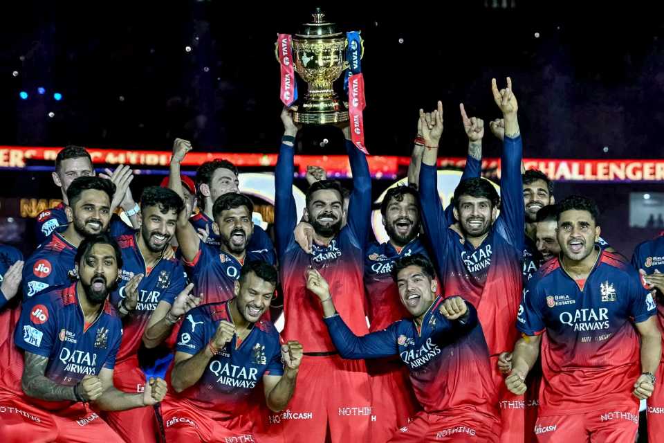 Virat Kohli, with the trophy in hand, celebrates RCB's IPL win with rest of his team-mates, Punjab Kings vs Royal Challengers Bengaluru, IPL 2025 final, Ahmedabad, June 3, 2025