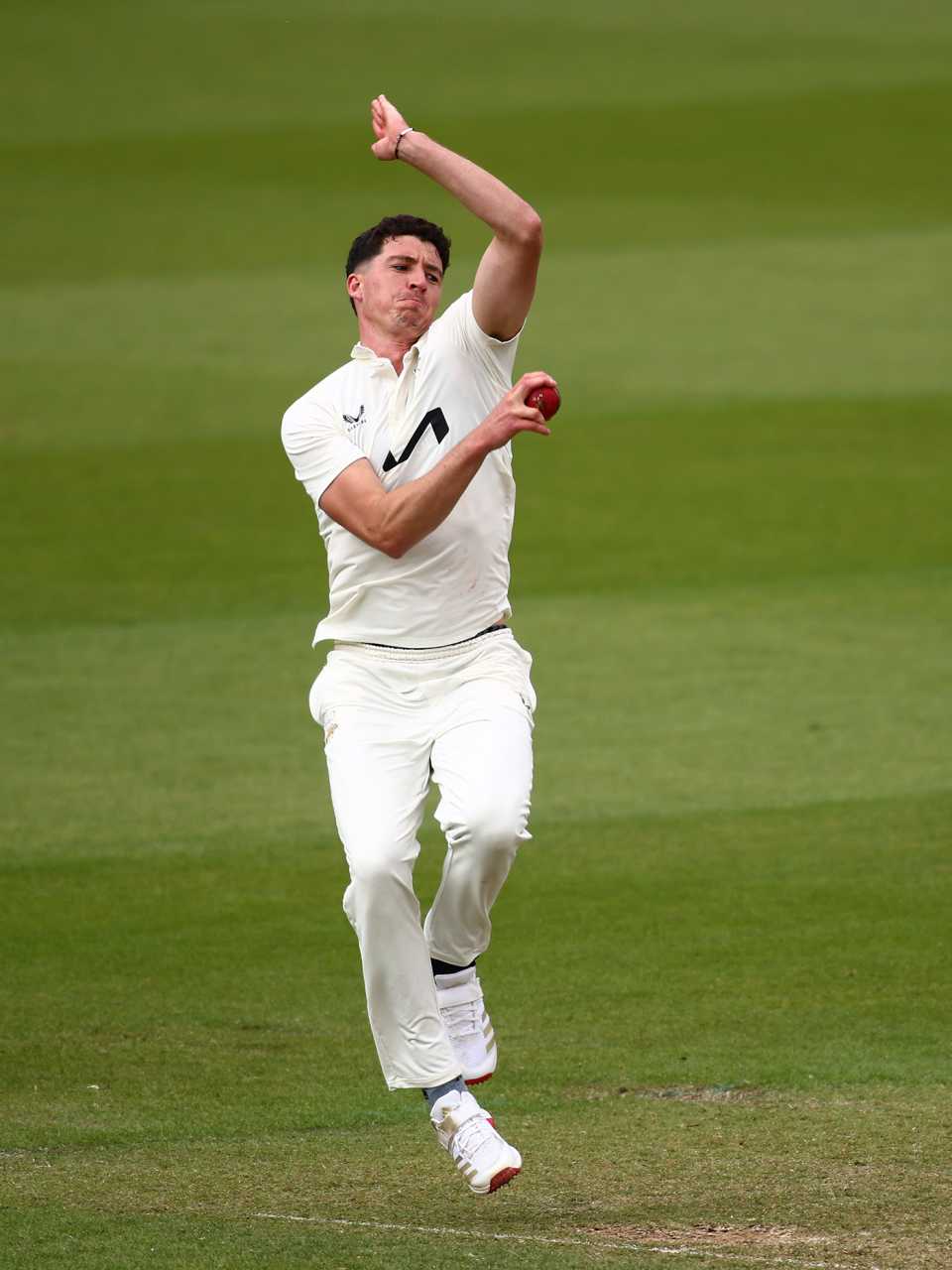 Matt Fisher jumps into his delivery stride, Surrey vs Yorkshire, County Championship, Division One, Kia Oval, May 18, 2025