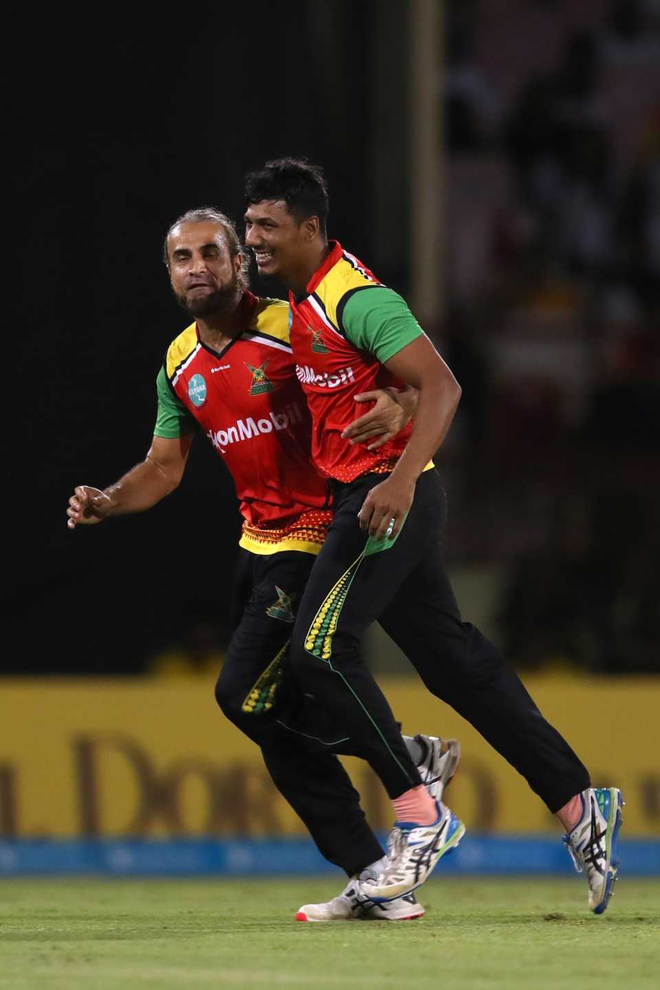 Imran Tahir and Gudakesh Motie celebrate the wicket of Kieron Pollard, Guyana Amazon Warriors vs Trinbago Knight Riders, CPL 2023, final, Providence, September 24, 2023