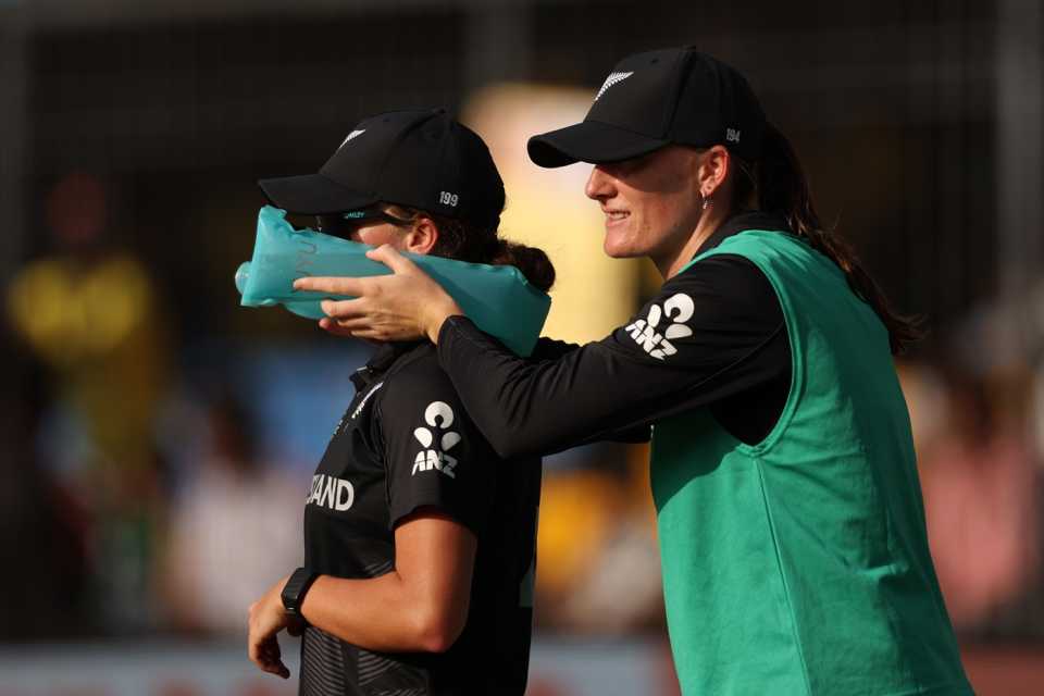 Substitute Rosemary Mair helps Eden Carson cool with an icepack, Australia vs New Zealand, ICC Women's World Cup, Indore, October 1, 2025