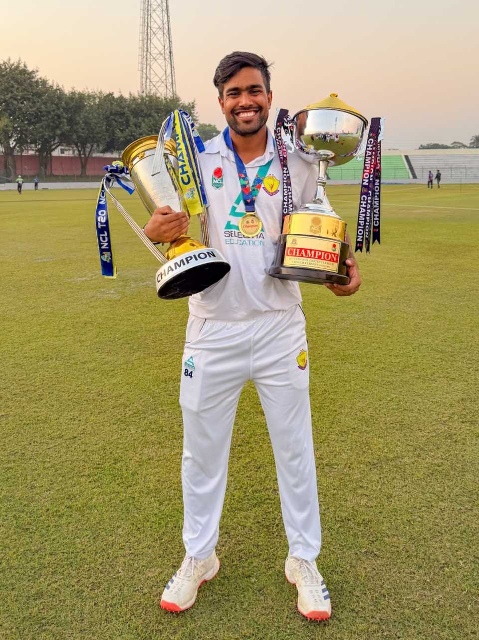 Akbar Ali with both NCL T20 and first-class trophies, Bogra, December 9, 2025