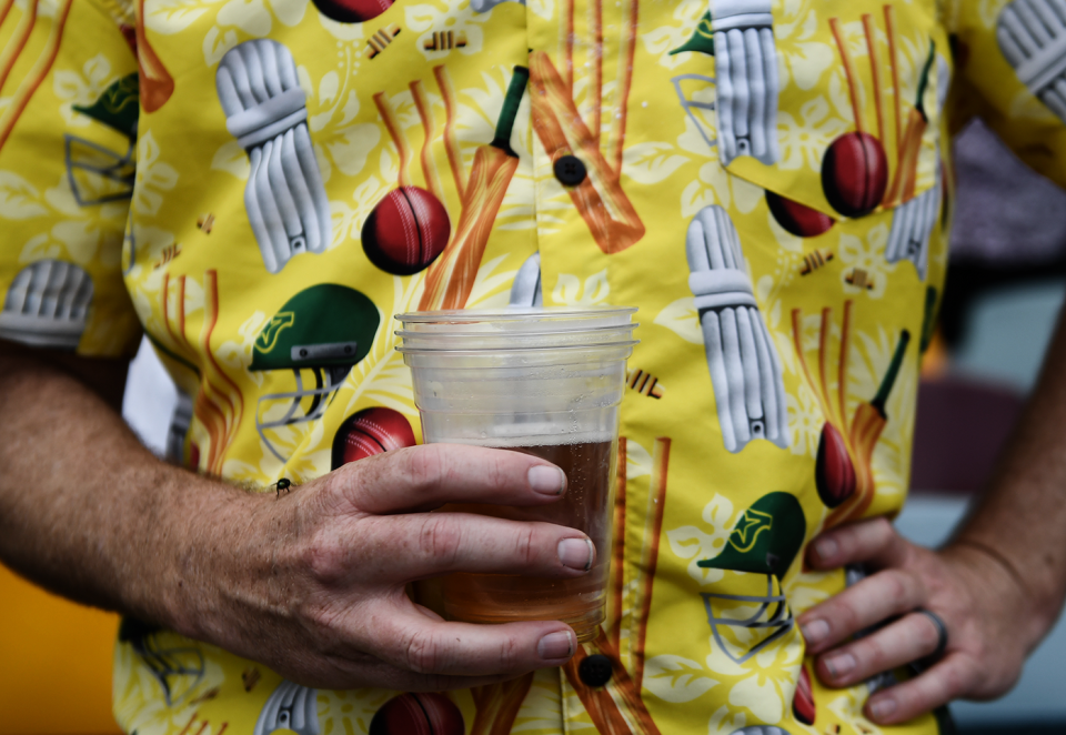 A fan in a colourful cricket-themed shirt holds a beer, Australia vs England, 2nd Test, Brisbane, 3rd day, December 7, 2025