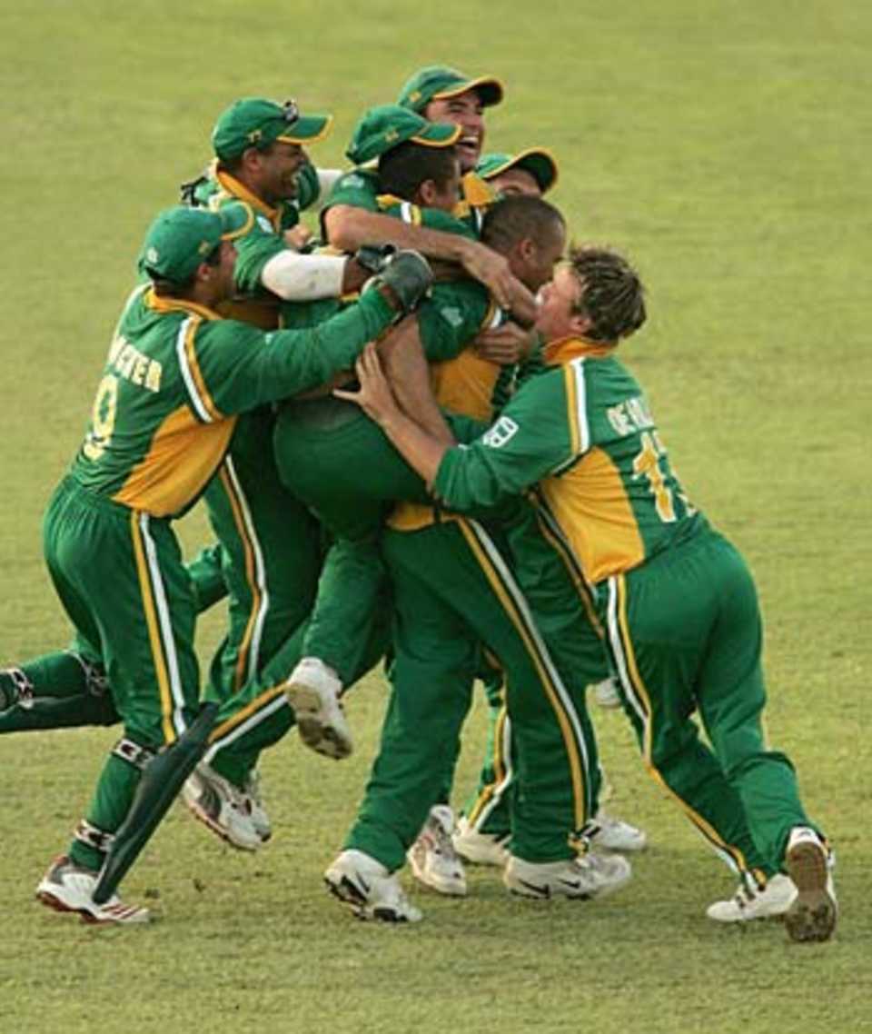 Jubilant South Africans mob Charl Langeveldt after his hat-trick had given them a one-wicket win, West Indies v South Africa, 3rd ODI, Barbados, May 11, 2005