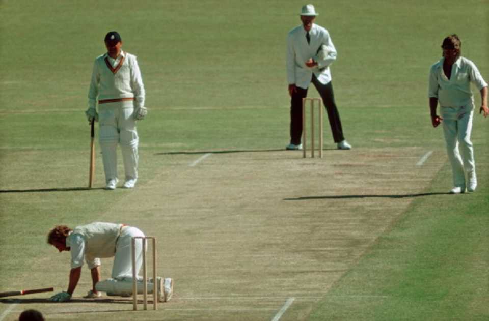 David Lloyd collapses after being hit by a ball from Jeff Thomson 