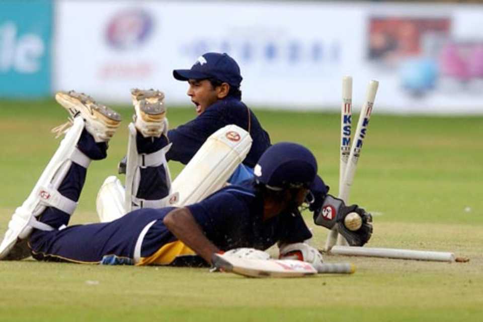 Parthiv Patel appeals for a run-out against Lakshmipathy Balaji in the David Johnson benefit match, Dravid XI v Sehwag XI, Bangalore, JUly 17