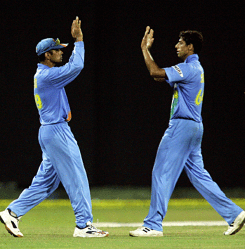 Rahul Dravid and Ashish Nehra celebrate a wicket, India v West Indies, Premadasa Stadium, August 7, 2005