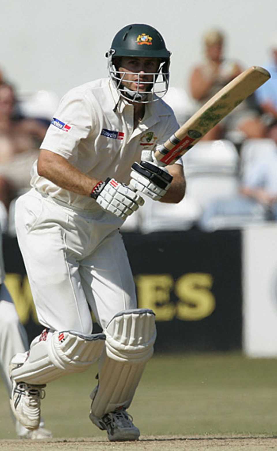 Simon Katich punches one down the ground