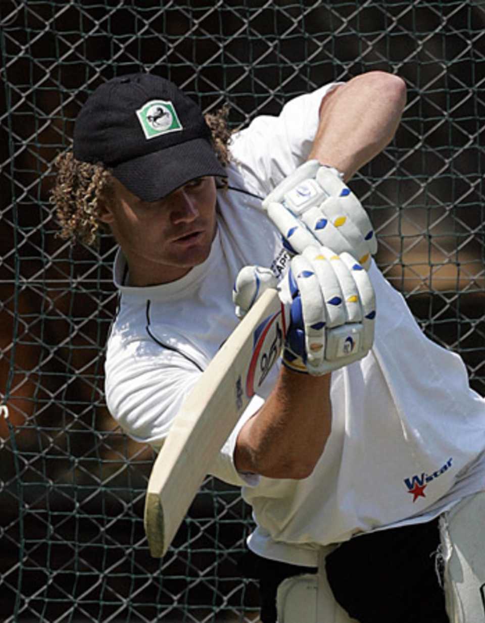 Hamish Marshall punches one down the ground during a net session at Harare, September 5, 2005