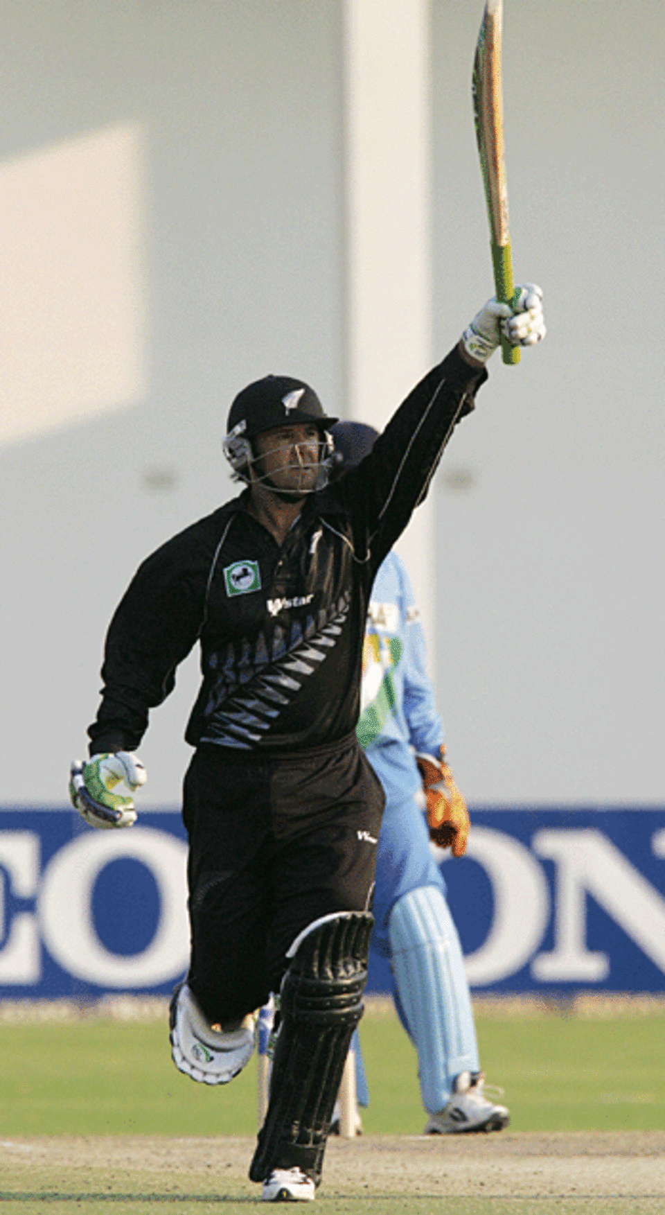 Nathan Astle celebrates a match-winning century, India v Zimbabwe, Harare, September 6, 2005