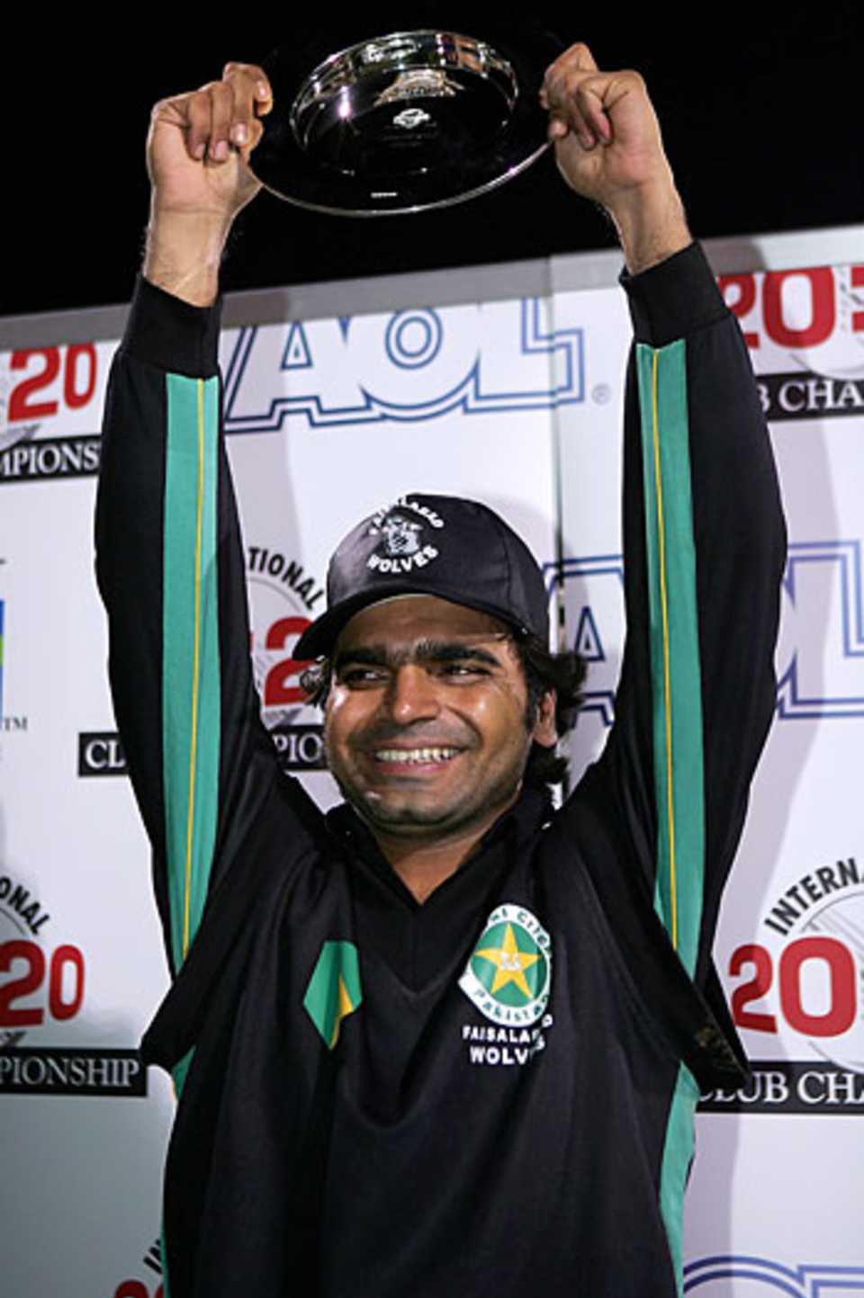 Naved Latif lifts the International 20:20 trophy