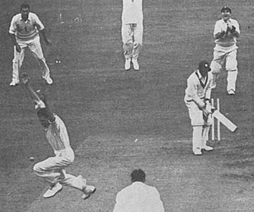 Peter Loader bowls Roy Gilchrist to take a hat-trick