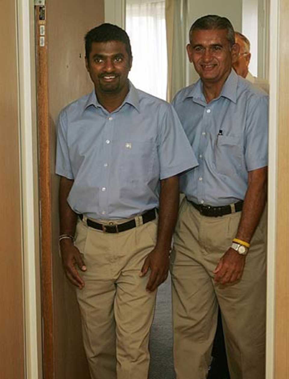 Muttiah Muralitharan and Michael Tissera, Sri Lanka's manager, arrive at a press conference at the University of Western Australia's School of Human Movement, Perth, February 4, 2006