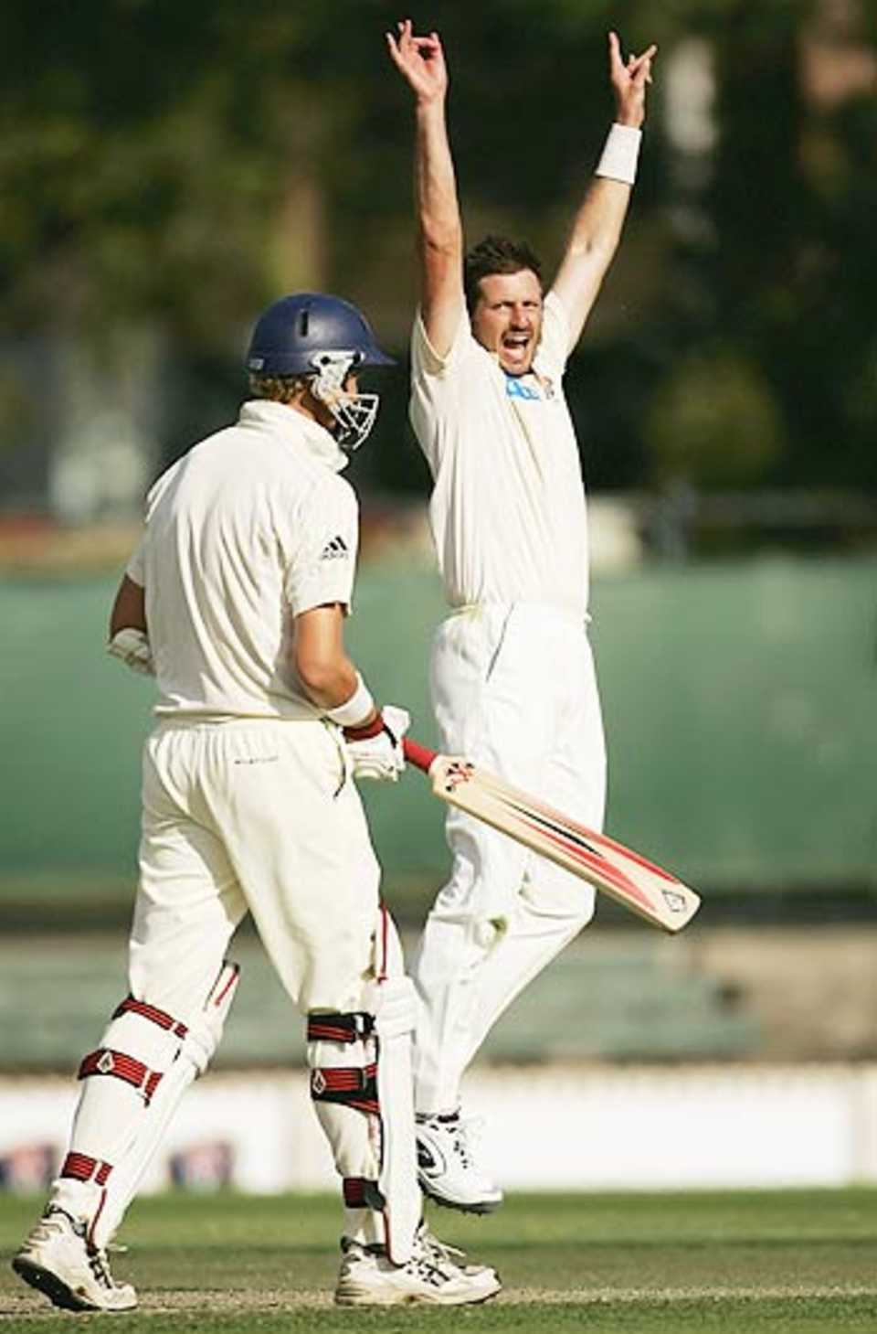 Michael Kasprowicz celebrates a wicket