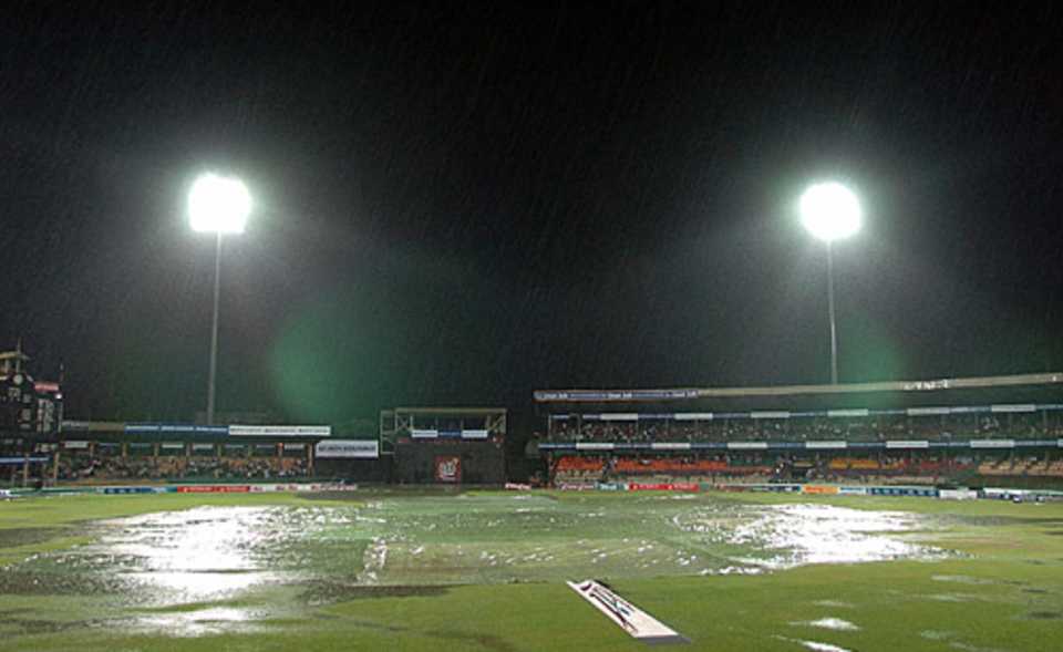 Floodlights illuminate a very damp Premadasa Stadium