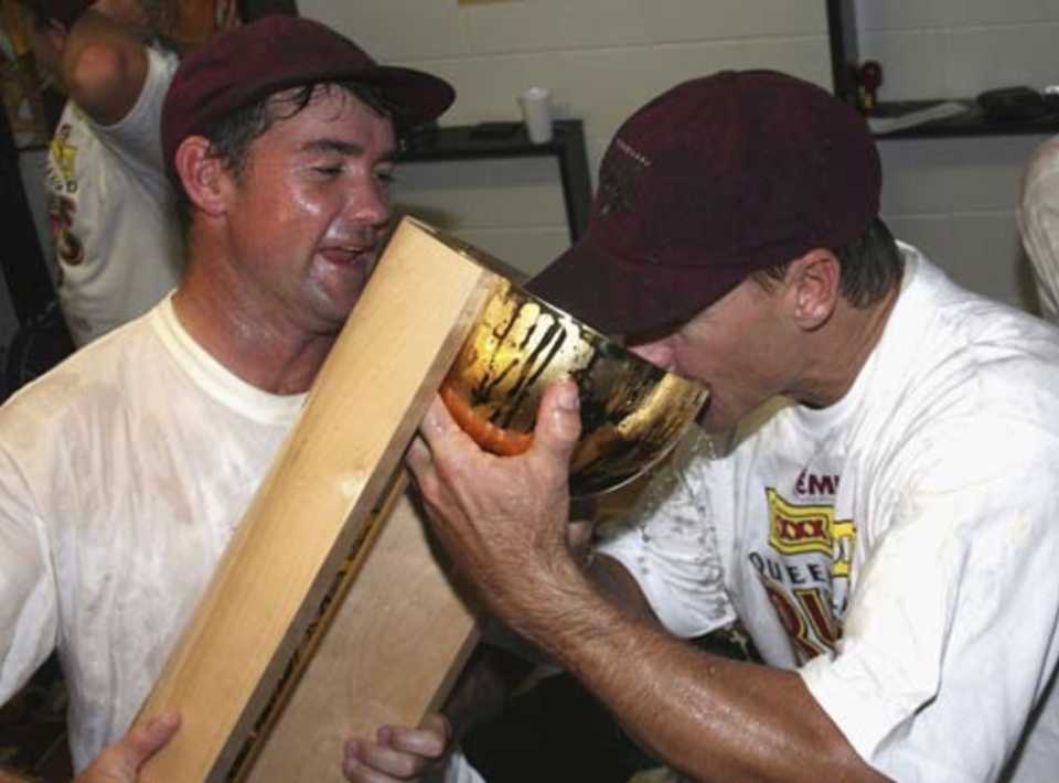 Jimmy Maher and Andy Bichel celebrate the victory in style