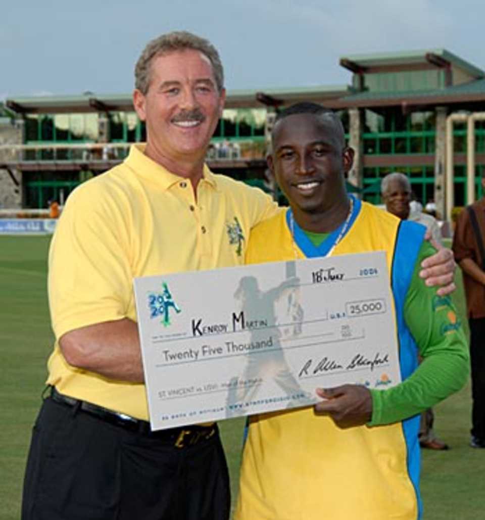 Kenroy Martin collects his $25,000 Man-of-the-Match award