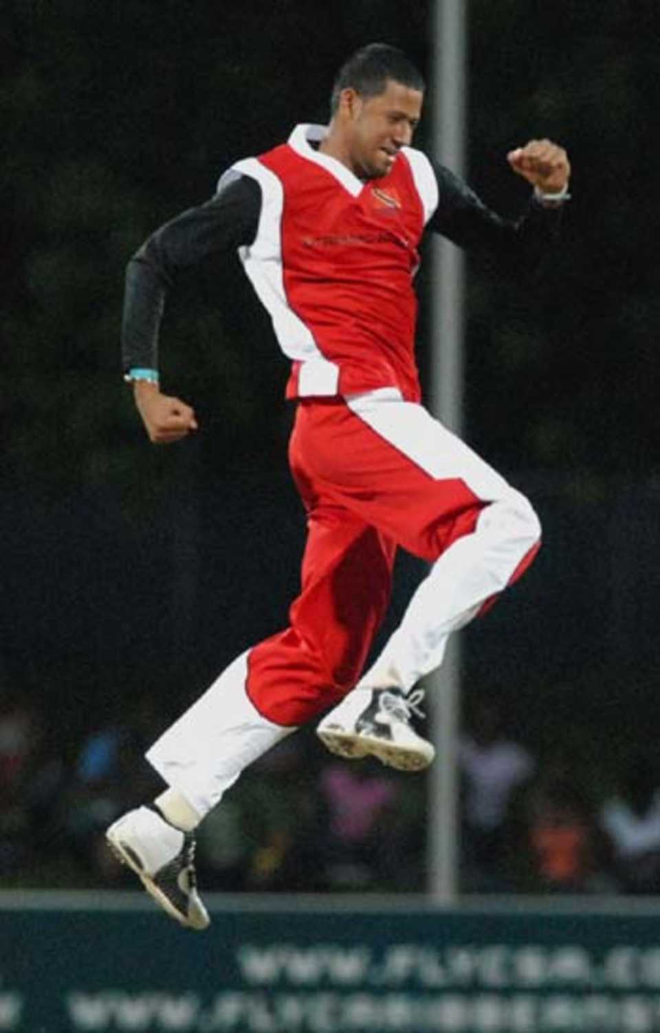 Rayad Emrit celebrates one of his two wickets