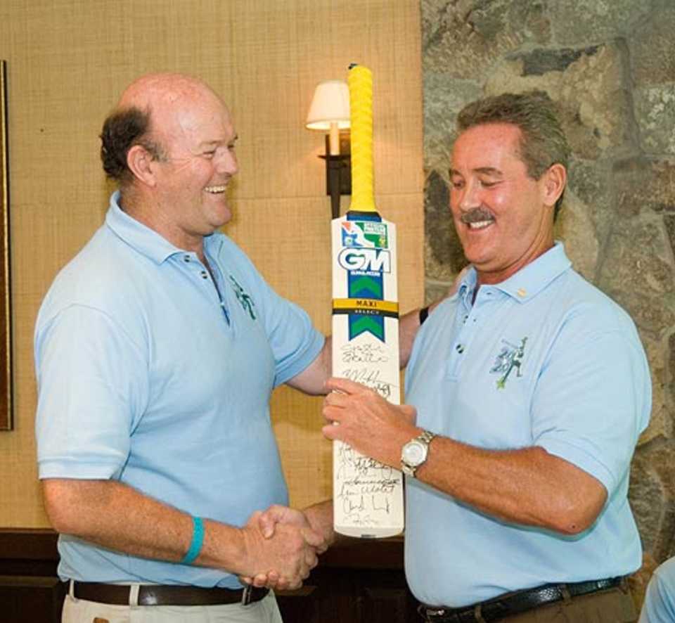 Vince Van der Bijl presents Allen Stanford with a commemorative bat from the South Africa team