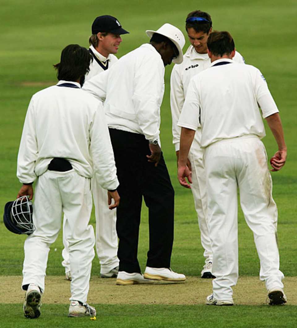 Vanburn Holder examines the pitch after it was hit by a water bomb, Lancashire v Warwickshire, County Championship, Blackpool, August 30, 2006