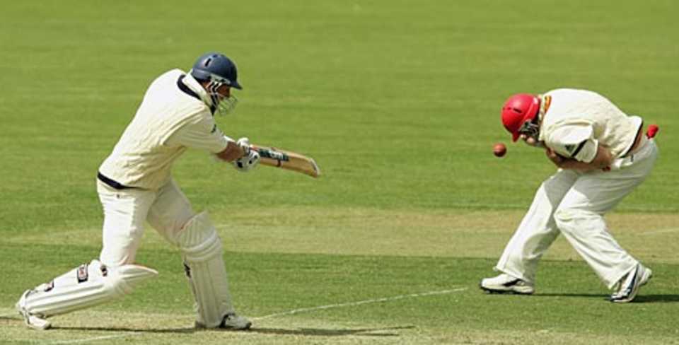 David Hussey pulls the ball into Mark Cosgrove , South Australia v Victoria, Pura Cup, 6th match, Adelaide, October 27, 2006
