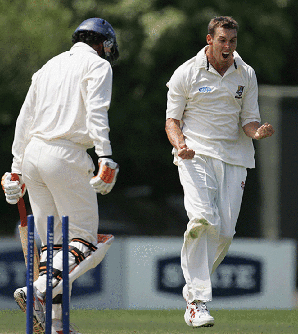 Northern Districts bowler Brent Arnel celebrates after getting Auckland's Tama Canning