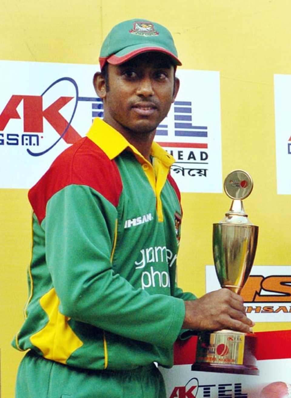 Aftab Ahmed holds the Man Of The Series trophy after Bangladesh's 2-0 win over Scotland