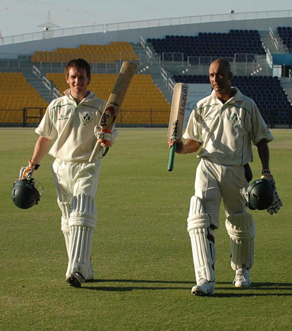 Eoin Morgan and Andre Botha walk off after their record stand