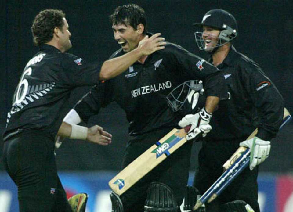 Stephen Fleming celebrates with team-mates Chris Cairns and Nathan Astle