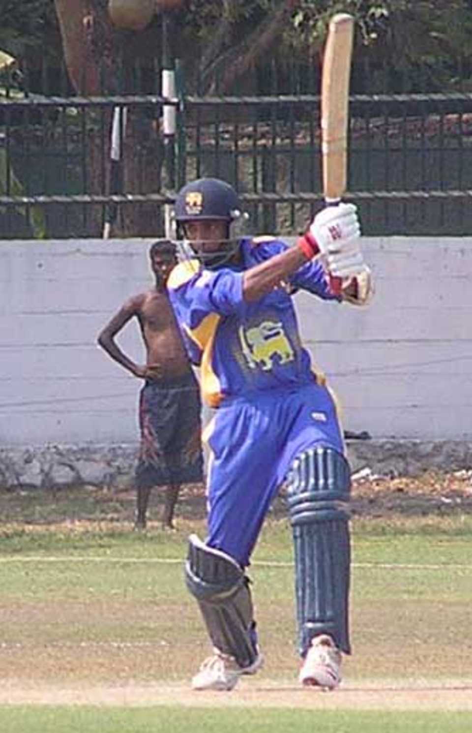 Dilruwan Perera goes through the covers during his 56