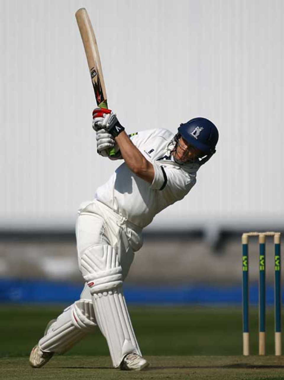 James Troughton lofts down the ground during his century