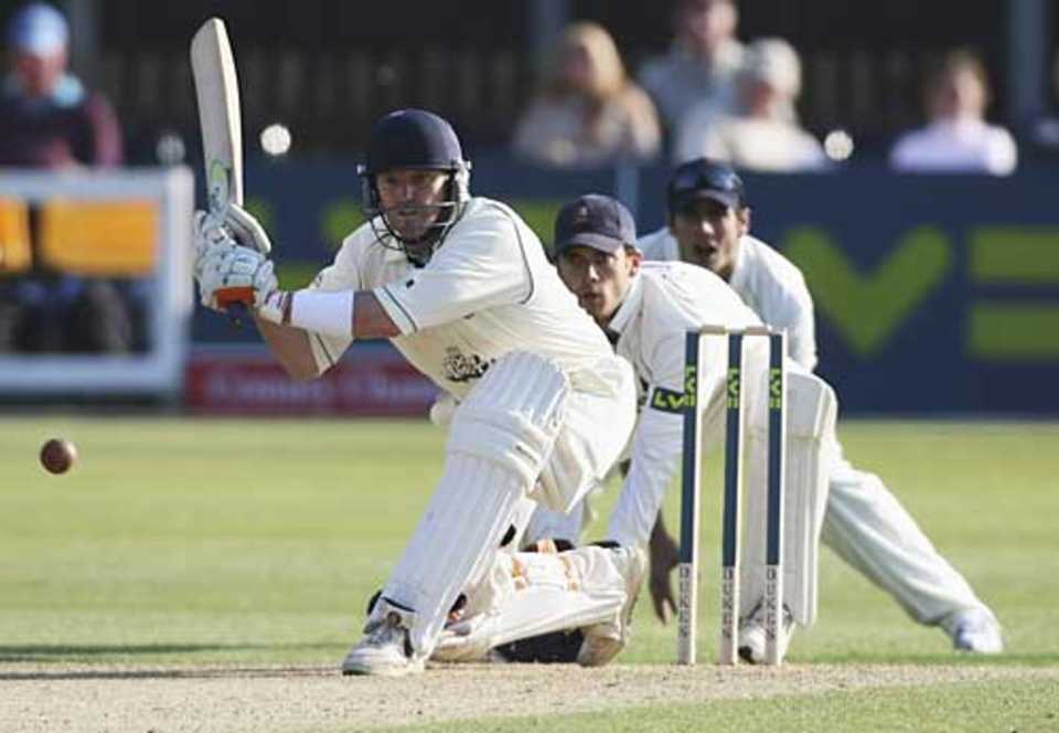 Ian Harvey sweeps during his opening-day century against Essex