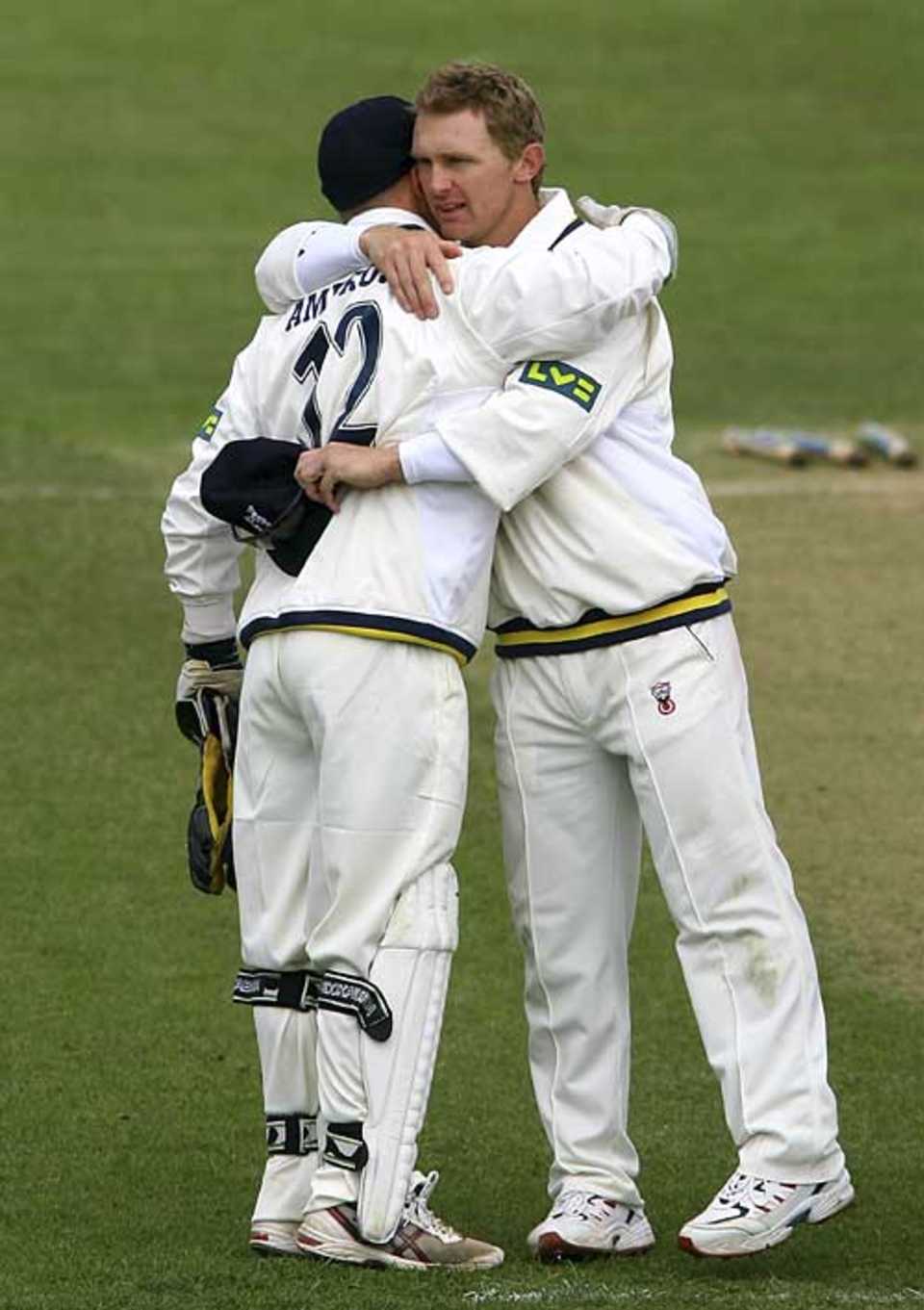 Darren Maddy celebrates victory in his first match as Warwickshire captain with Tim Ambrose