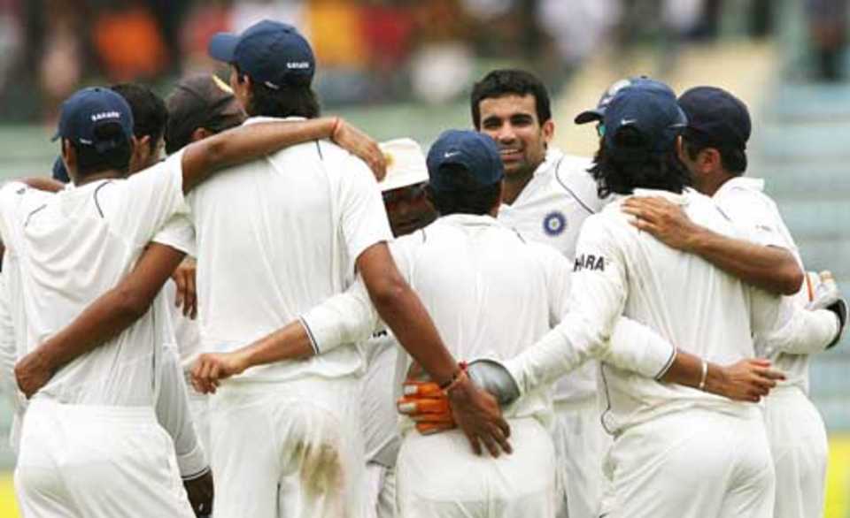The Indians gather in a huddle to celebrate their series-sealing win over Bangladesh in the second Test