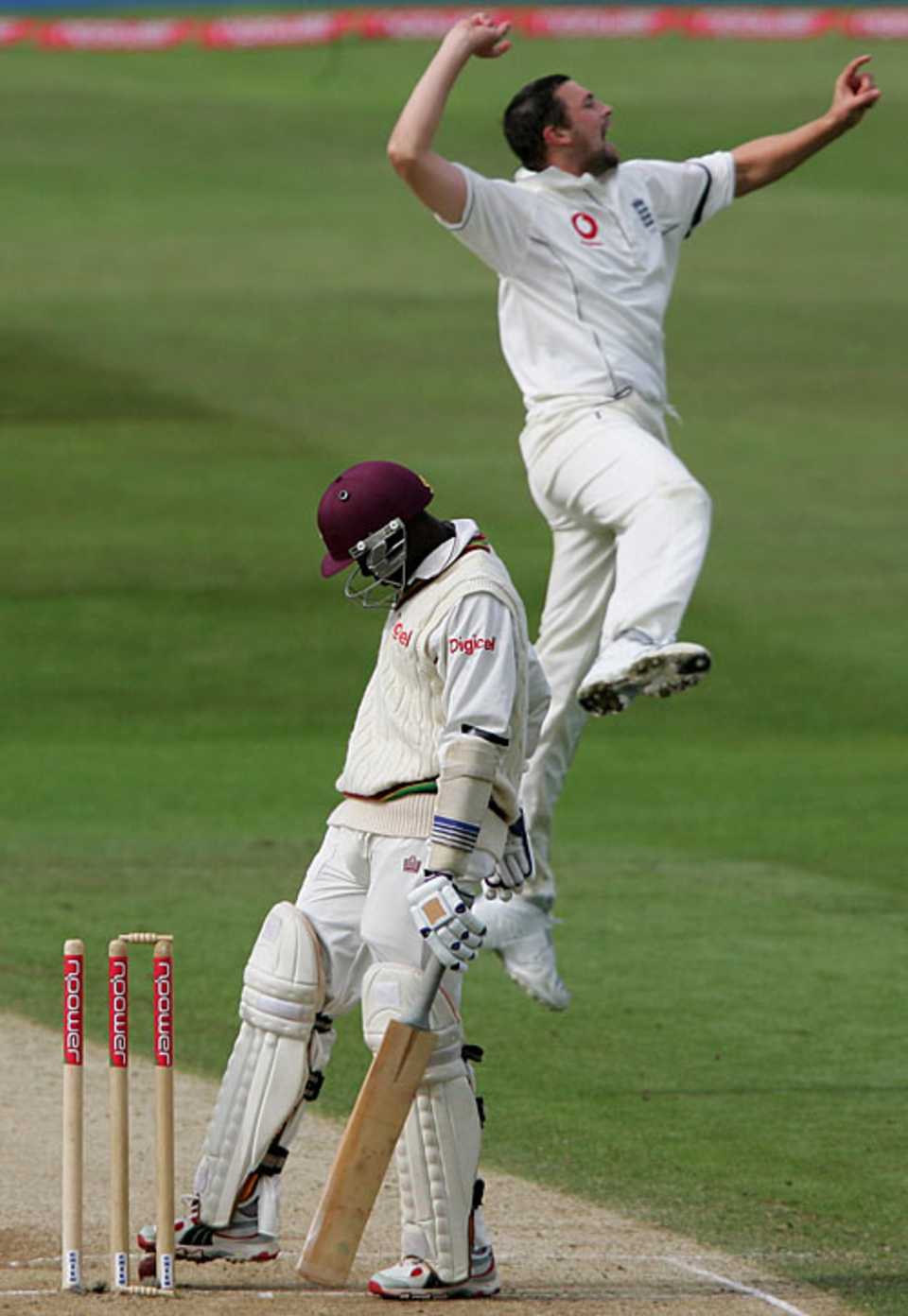 Jerome Taylor watches his bail tumble as Steve Harmison celebrates the winning wicket
