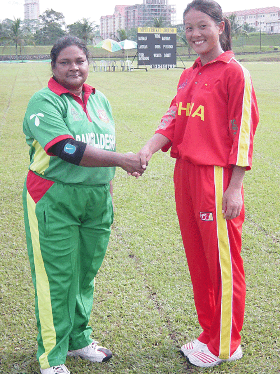 Bangladesh captain Tajkia Akhter and China captain Mei Chin Hua shake hands before their game, Bangladesh women v China women, ACC tournament, Johor, July 15, 2007