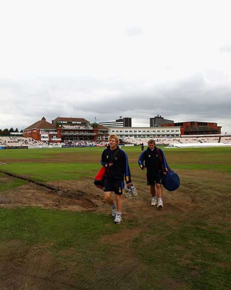 Two Hampshire players walk across Old Trafford's muddy outfield, Lancashire v Hampshire, County Championship, Old Trafford, August 22, 2007