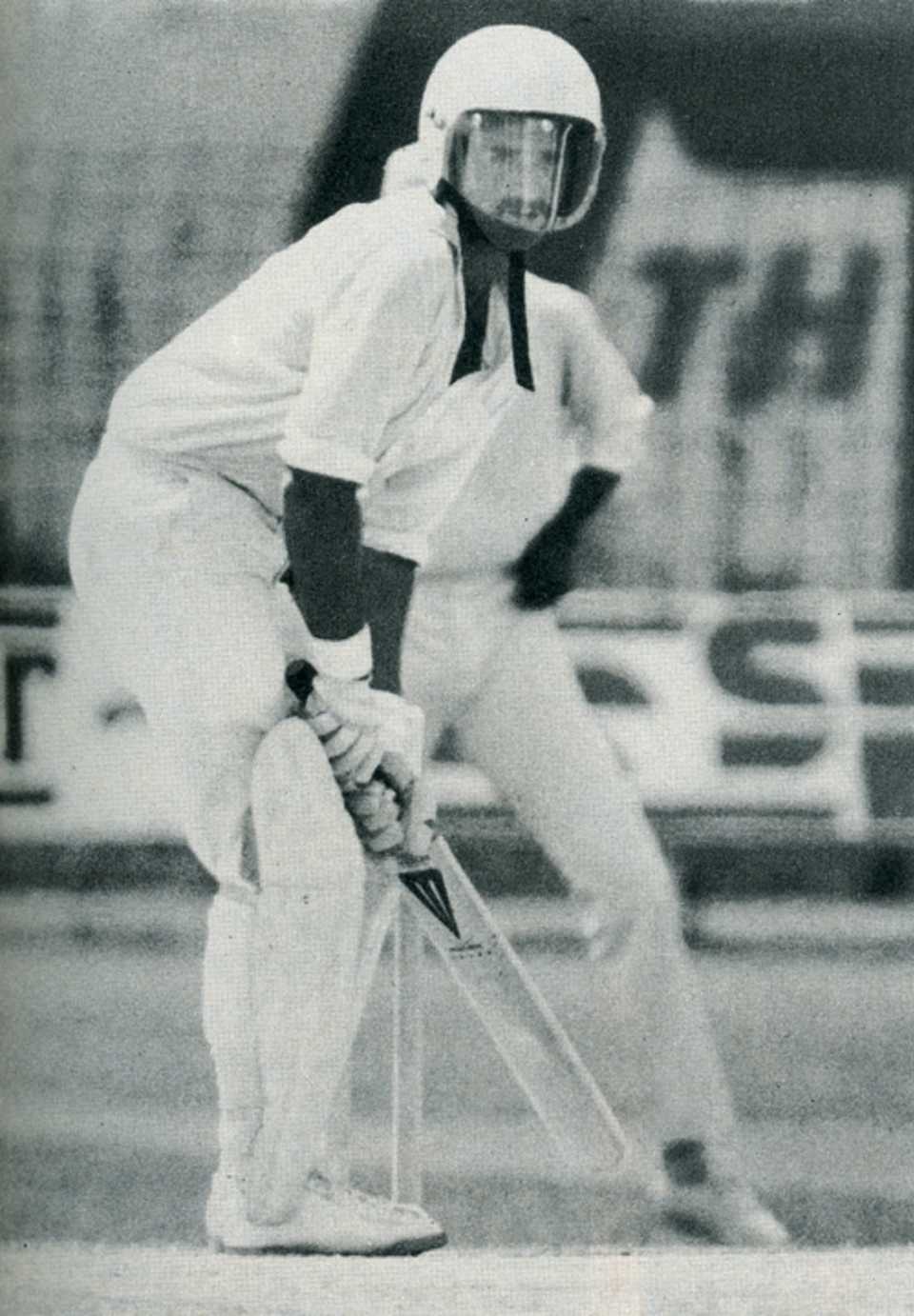 Graham Yallop takes guard in a helmet