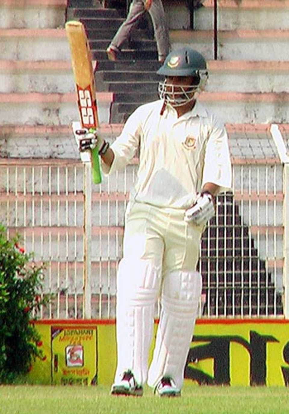 Chittagong opener Tamim Iqbal raises his bat after reaching his half century against Barisal, October 21, 2007