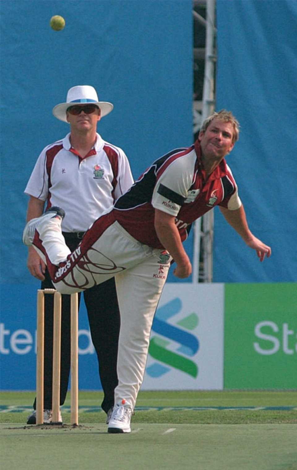 Shane Warne turns his arm over during the Hong Kong Cricket Sixes