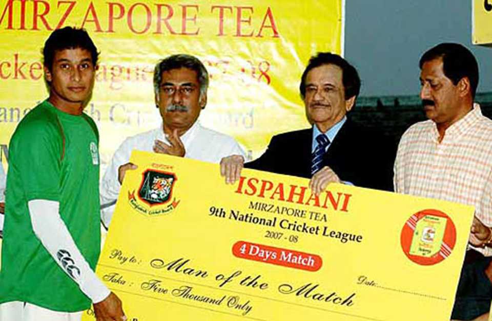 Barisal's Sajidul Islam receives his Man-of-the-Match award
