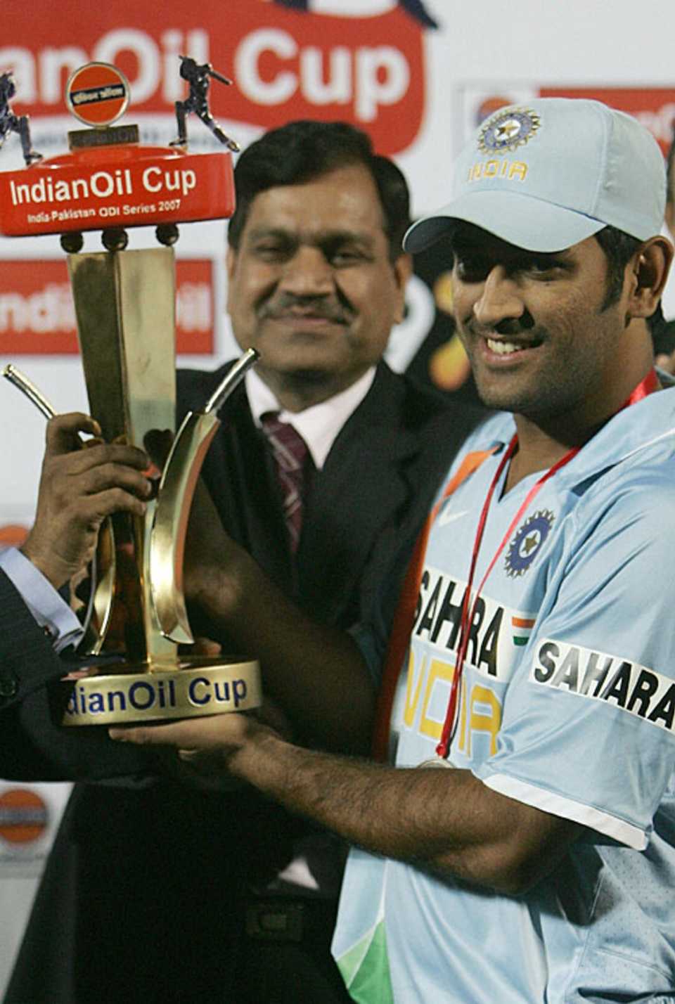 Mahendra Singh Dhoni lifts the trophy after India won the series 3-2