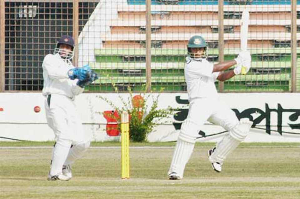 Nafees Iqbal square-cuts during his unbeaten 118