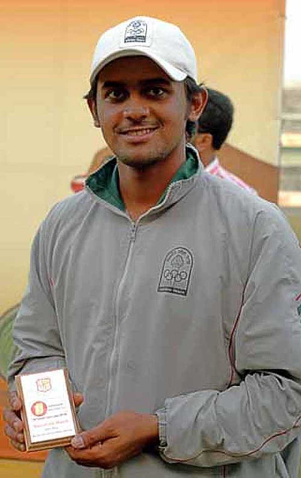 Shahriar Nafees poses with his Man-of-the-Match award 